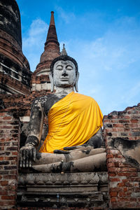 Low angle view of statue against sky