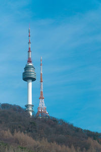 Low angle view of communications tower against sky