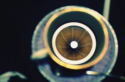 Close-up of tea cup on black background