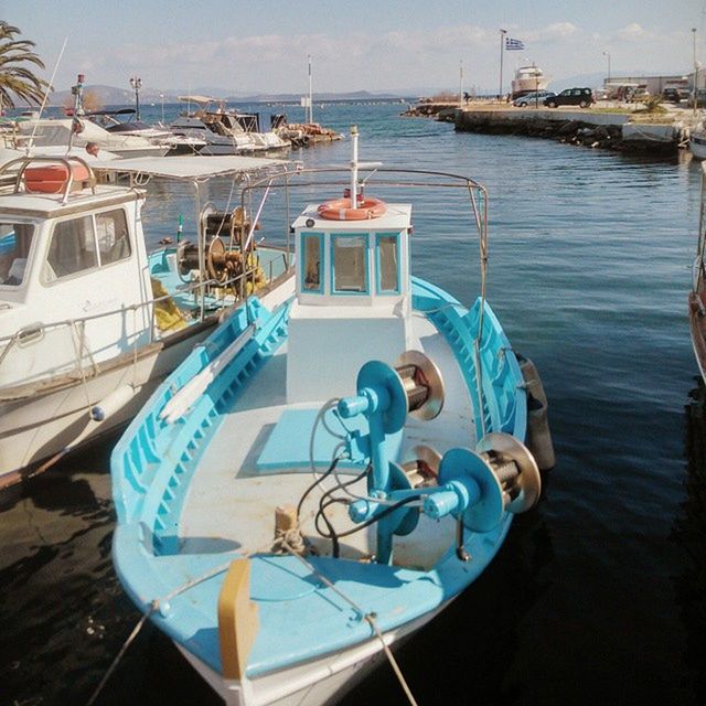 nautical vessel, water, moored, boat, transportation, mode of transport, sea, harbor, mast, sailboat, sky, rope, blue, day, travel, nature, tranquility, outdoors, beach, waterfront