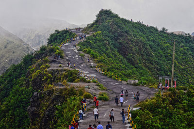 High angle view of people walking on road