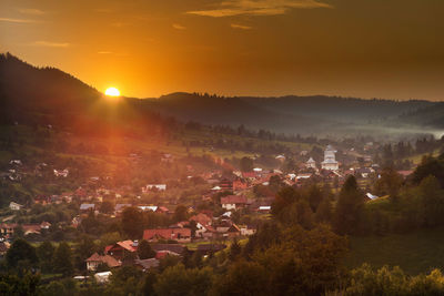 High angle view of townscape during sunset