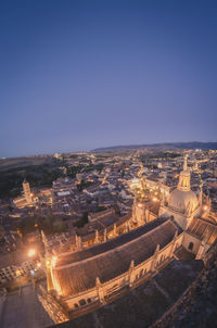 High angle view of illuminated buildings in city