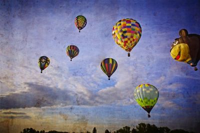 Low angle view of hot air balloons against sky