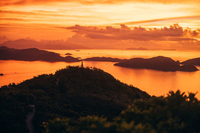 Scenic view of sea against romantic sky at sunset