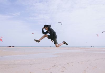 Man jumping on beach