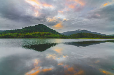 Scenic view of lake against sky during sunrise