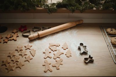 High angle view of unbaked gimgerbread cookies on kitchen countertop