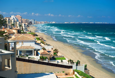 View of beach against sky in city