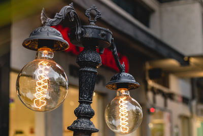 Low angle view of illuminated light bulb