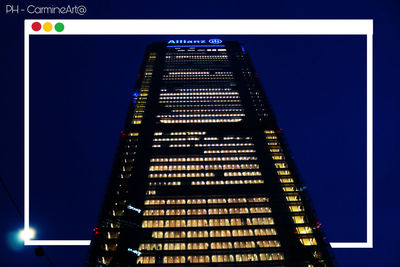 Low angle view of illuminated building against blue sky