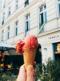 Hand holding ice cream cone