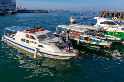 High angle view of sailboats moored in sea