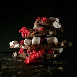 Close-up of chocolate on table against black background