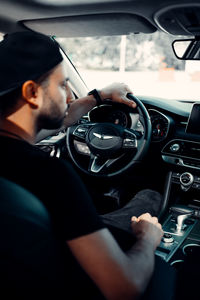 Reflection of man in car
