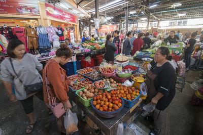 People at market stall