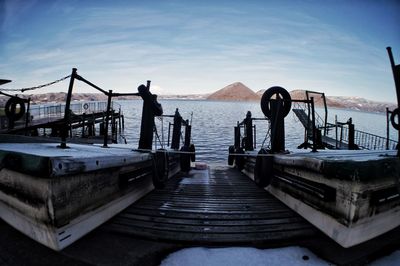 Pier by sea against sky