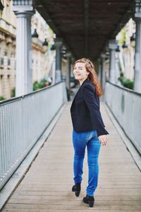 Full length of woman standing outdoors