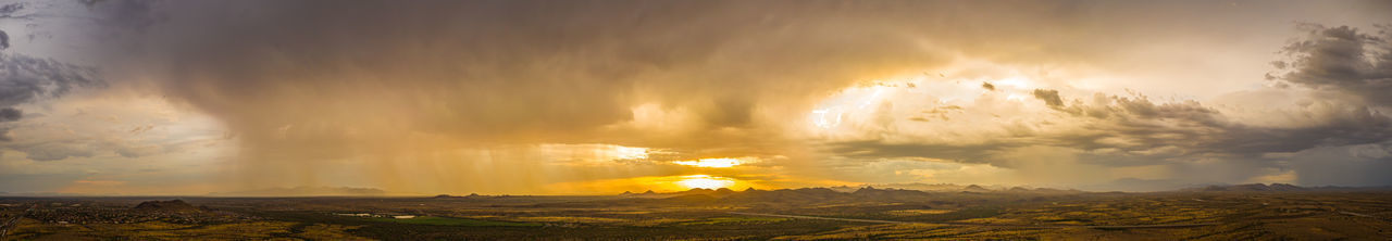 Panoramic view of lightning against sky during sunset