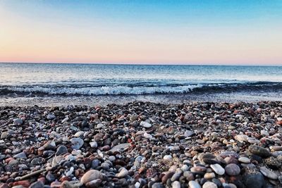 Scenic view of sea against clear sky during sunset