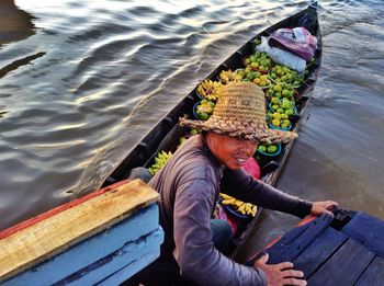 High angle view of woman sitting in lake