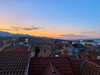 High angle view of townscape against sky at sunset