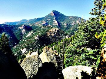 Scenic view of mountains against clear blue sky