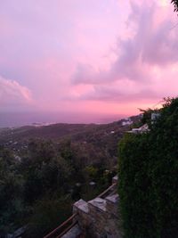 Scenic view of landscape against sky at sunset