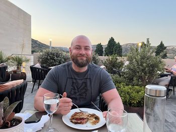 Portrait of man having food at restaurant