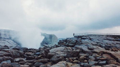 Rocks on shore against sky