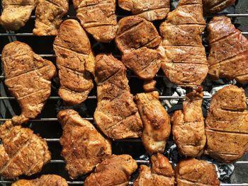 High angle view of meat cooking on barbecue grill