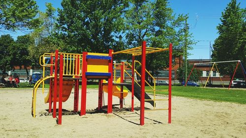Playground in park against sky