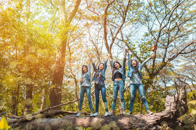 People standing by trees during autumn