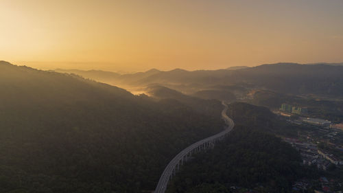 Scenic view of mountains against sky during sunset