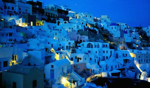 Buildings in city at dusk