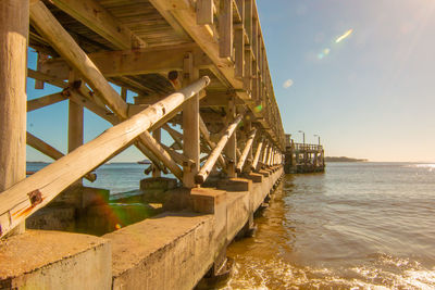 Pier over sea against sky