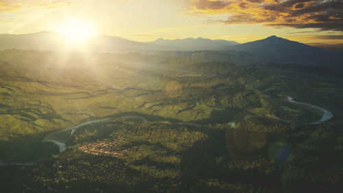 Scenic view of mountains against sky during sunset