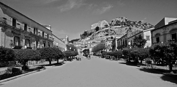 View of road along buildings