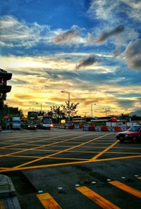 Cars on road at sunset