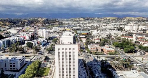 High angle view of buildings in city against sky