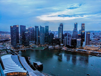 High angle view of bay and buildings against sky