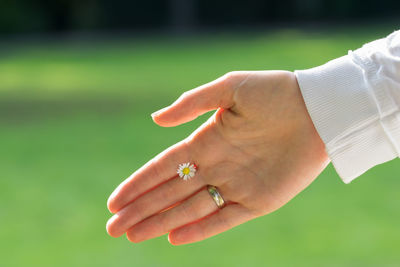 Close-up of man holding hands