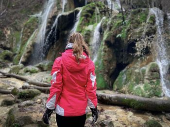 Rear view of woman walking on mountain