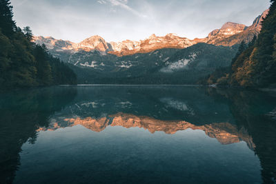 Scenic view of lake and mountains against sky