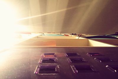 Surface level of multi colored umbrellas against bright sun