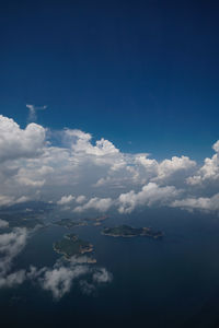 Aerial view of clouds over sea against sky