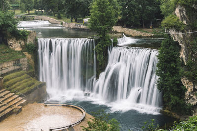 Scenic view of waterfall in forest