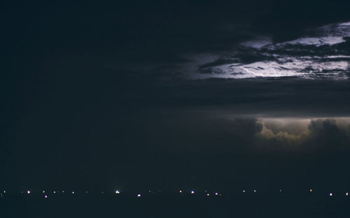 Scenic view of mountains against sky at night