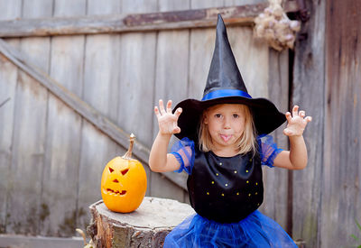 Little witch with pumpkin