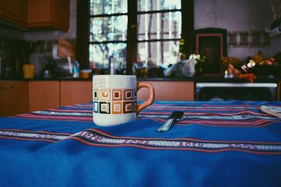 Close-up of coffee cup on table